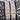 Four belts with different buckles on a reflective surface